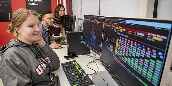 Three students woking on computers in the Bloomberg Lab.