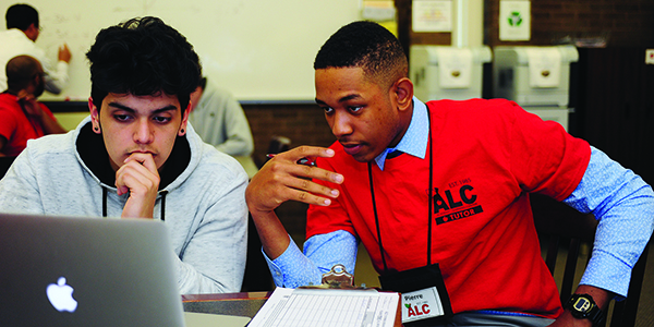 A sutdent working with a UCNJ peer tutor.