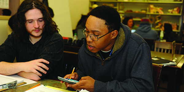 A student using a calculator.